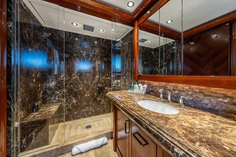 Slide: The Image of Luxurious marble bathroom in 2013 Westport W164 yacht with glass shower enclosure. - 39