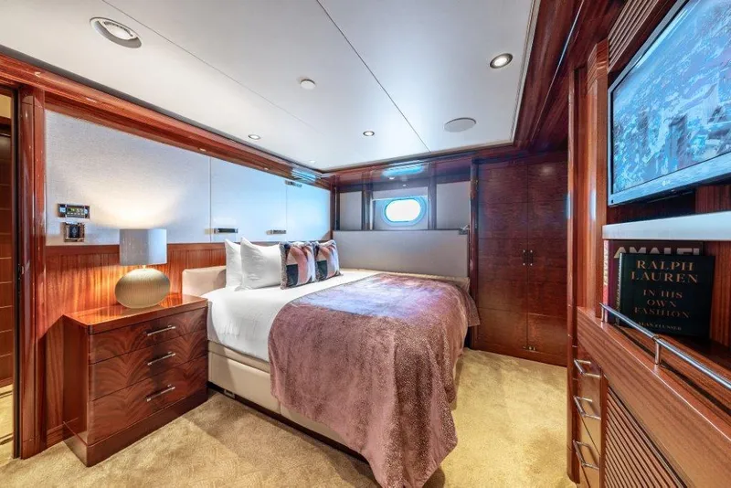 Slide: The Image of Luxurious bedroom interior on 2013 Westport W164 yacht with elegant wood finishes. - 40
