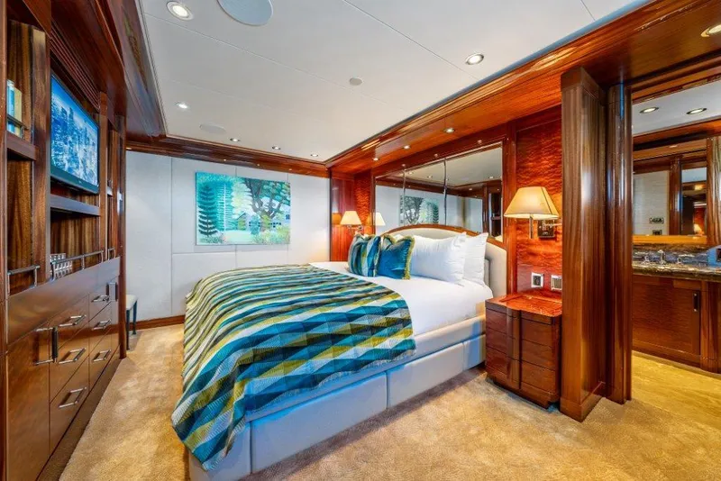 Slide: The Image of Luxurious bedroom interior in 2013 Westport W164 yacht with elegant wood finishes. - 41