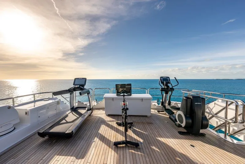 Slide: The Image of Luxury yacht Westport W164 2013 with gym equipment on deck, ocean view. - 6