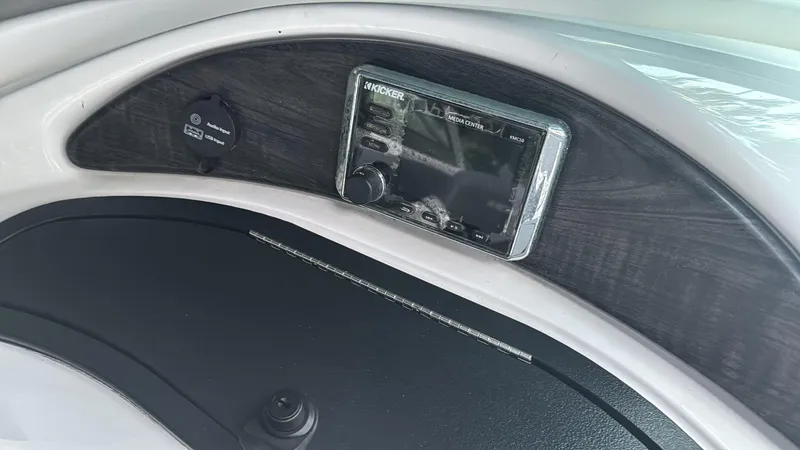 Slide: The Image of Dashboard of 2019 Rinker 21QX BR boat with Kicker audio system. - 6