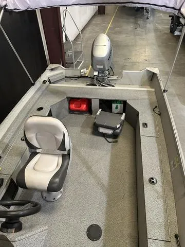 Slide: The Image of 2019 Starcraft 16 Patriot boat interior with Honda 30HP engine, featuring seating and storage. - 10