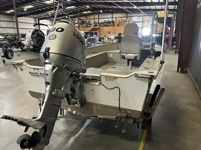 Slide: The Image of 2019 Starcraft 16 Patriot boat with Honda 30HP engine in a warehouse. - 4