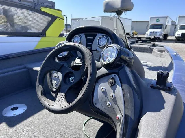 Slide: The Image of 2020 Tracker Pro Team 175 TF® boat dashboard with steering wheel and gauges. - 5