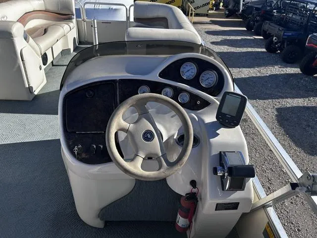 Slide: The Image of 2003 Fisher FREEDOM 240 DELUXE boat dashboard with steering wheel and gauges. - 10