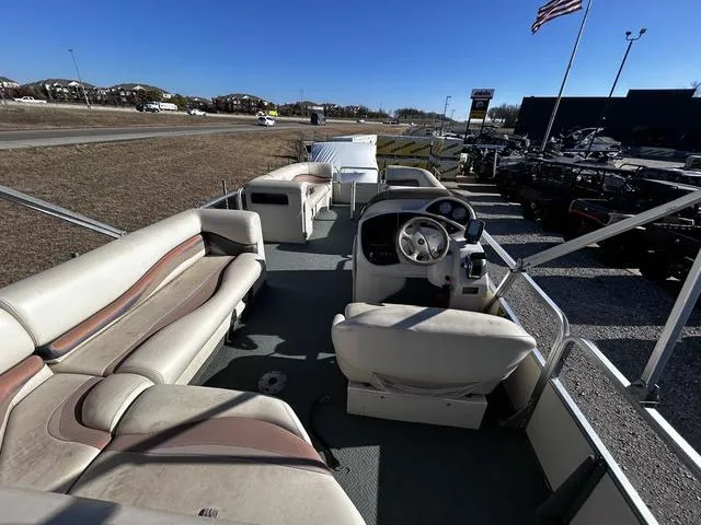Slide: The Image of 2003 Fisher FREEDOM 240 DELUXE pontoon boat with spacious seating and steering console. - 12