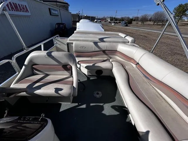 Slide: The Image of 2003 Fisher FREEDOM 240 DELUXE pontoon boat interior with cushioned seating. - 8