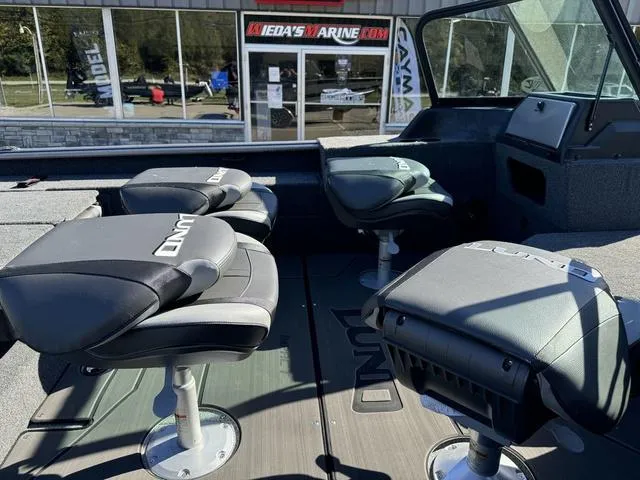 Slide: The Image of 2025 Lund 1875 Impact XS Sport boat interior with swivel seats. - 14
