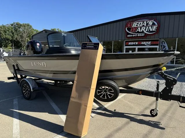 Slide: The Image of 2025 Lund 1875 Impact XS Sport boat on trailer at Wieda's Marine dealership. - 19