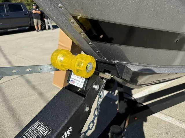 Slide: The Image of Close-up of 2025 Lund 1875 Impact XS Sport boat on trailer with yellow roller. - 20