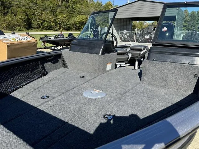 Slide: The Image of 2025 Lund 1875 Impact XS Sport boat interior with spacious deck and seating. - 22