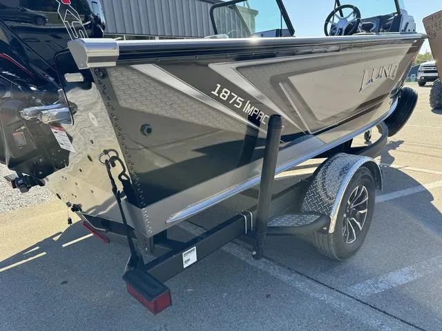 Slide: The Image of 2025 Lund 1875 Impact XS Sport boat on trailer, side view. - 9
