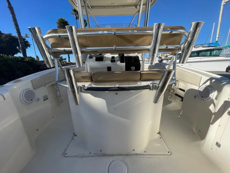 Slide: The Image of 2007 Scout 242 Sportfish boat interior with seating and rod holders. - 12
