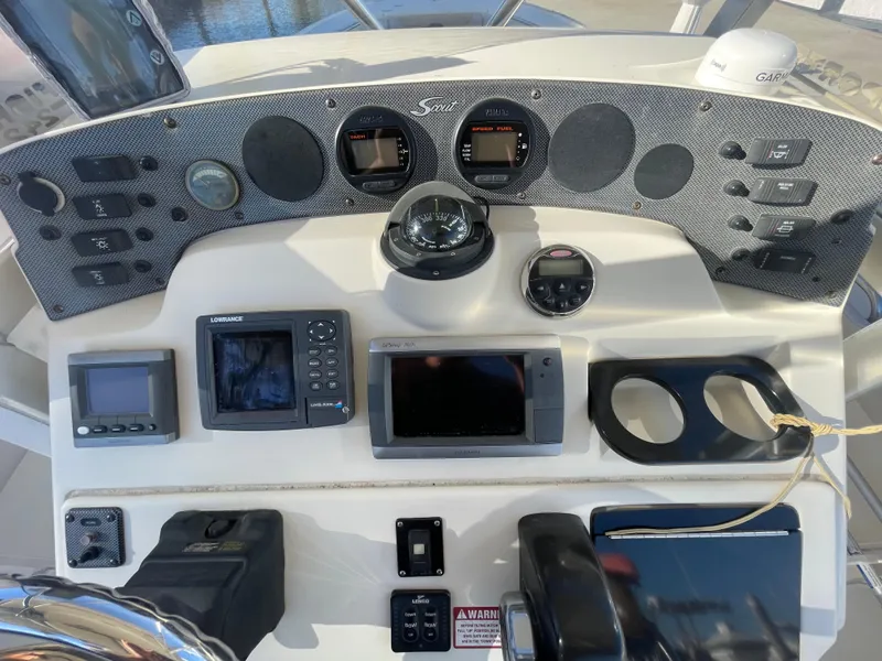 Slide: The Image of Control panel of a 2007 Scout 242 Sportfish boat with navigation instruments. - 19