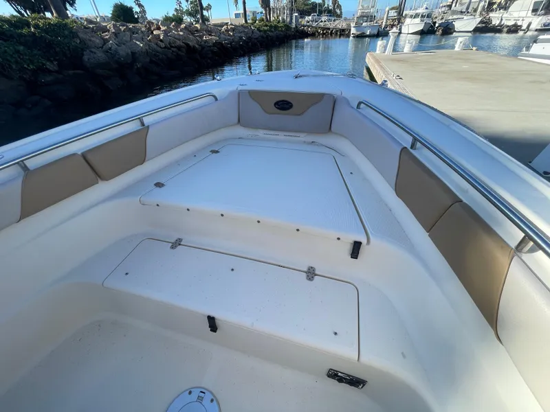 Slide: The Image of 2007 Scout 242 Sportfish boat interior with cushioned seating and storage compartments. - 23