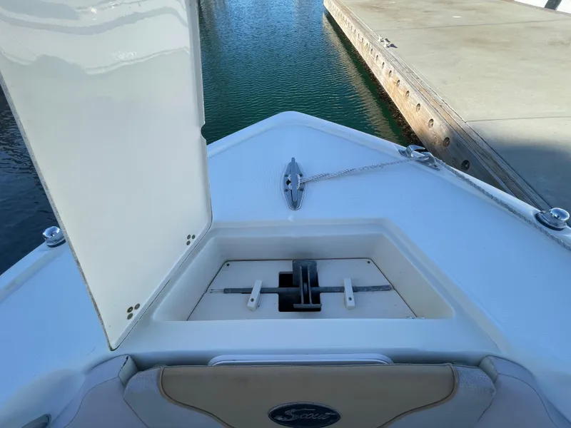 Slide: The Image of 2007 Scout 242 Sportfish boat anchor compartment at dock. - 29