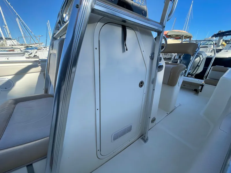 Slide: The Image of 2007 Scout 242 Sportfish boat interior with seating and storage compartment. - 31
