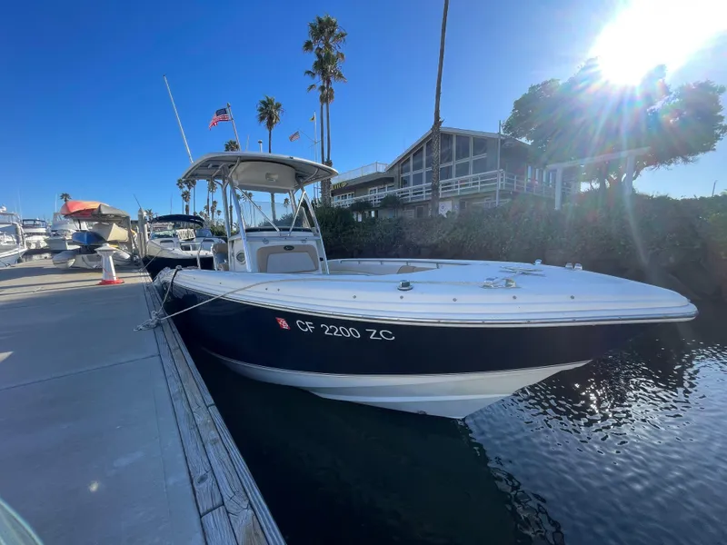Slide: The Image of 2007 Scout 242 Sportfish boat docked in sunny marina. - 37