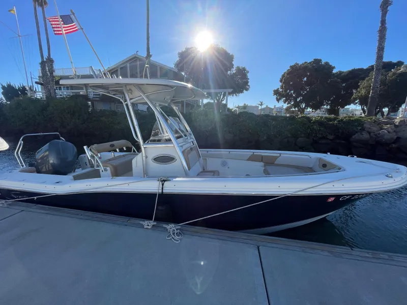 Slide: The Image of 2007 Scout 242 Sportfish boat docked under clear blue sky. - 38