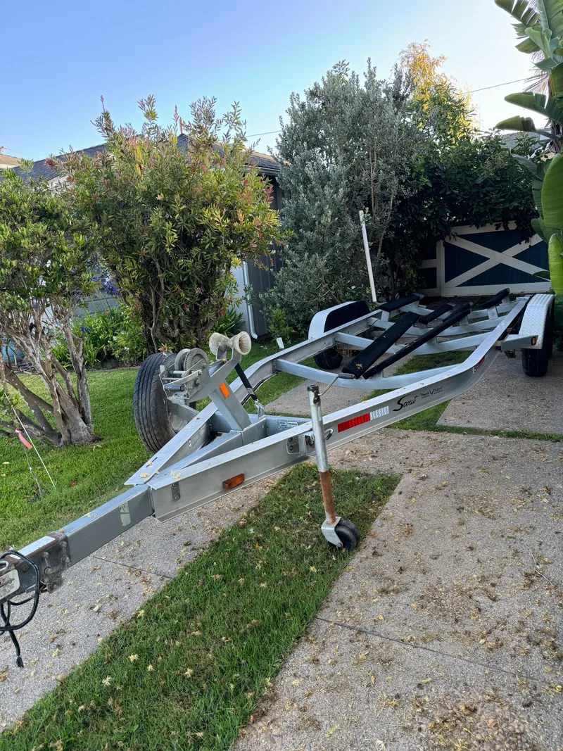 Slide: The Image of Boat trailer for 2007 Scout 242 Sportfish in a garden setting. - 40