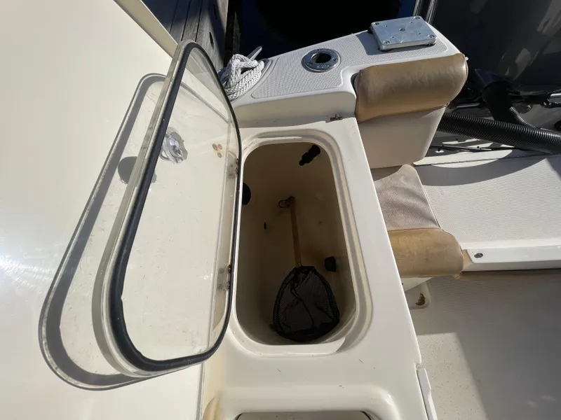 Slide: The Image of Open storage compartment on 2007 Scout 242 Sportfish boat. - 9