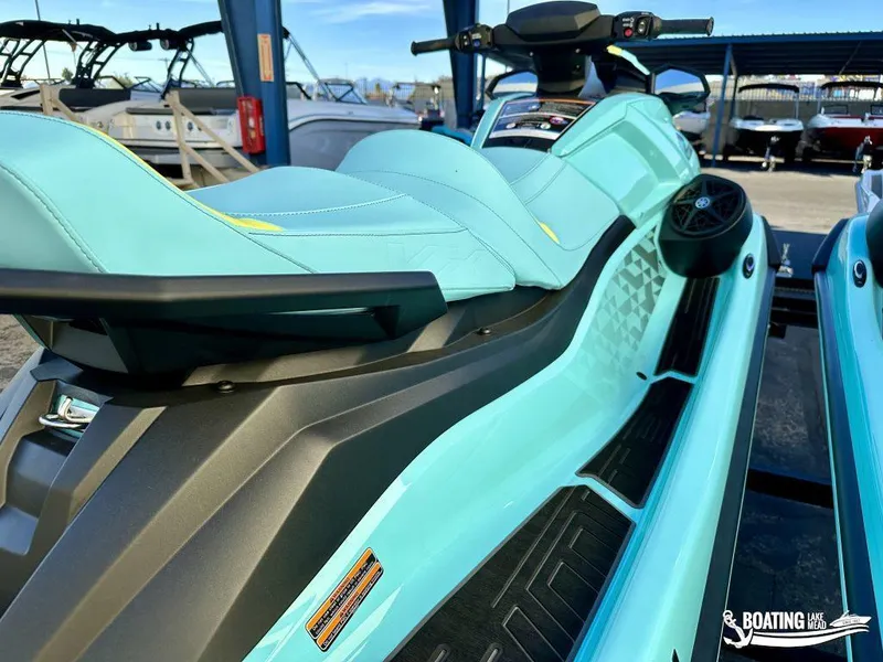 Slide: The Image of 2025 Yamaha WaveRunner VX Limited Ho in vibrant blue, parked at a marina. - 4