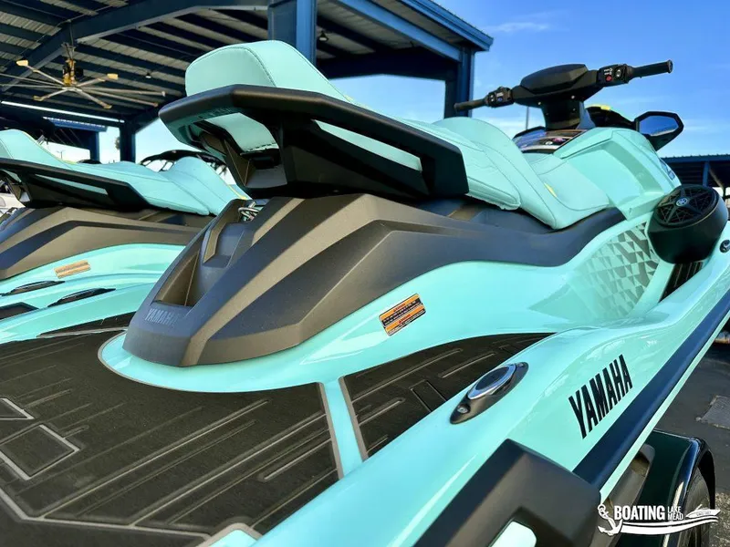 Slide: The Image of 2025 Yamaha WaveRunner VX Limited Ho in vibrant blue under a metal canopy. - 5