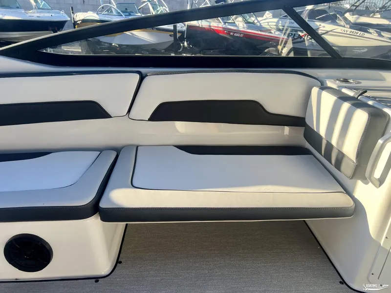 Slide: The Image of 2025 Yamaha AR195 boat interior with sleek white and black seating. - 2