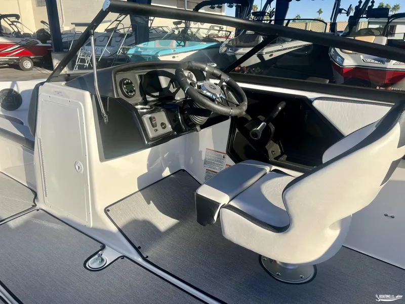 Slide: The Image of 2025 Yamaha Boats AR195 cockpit with steering wheel and seating. - 6