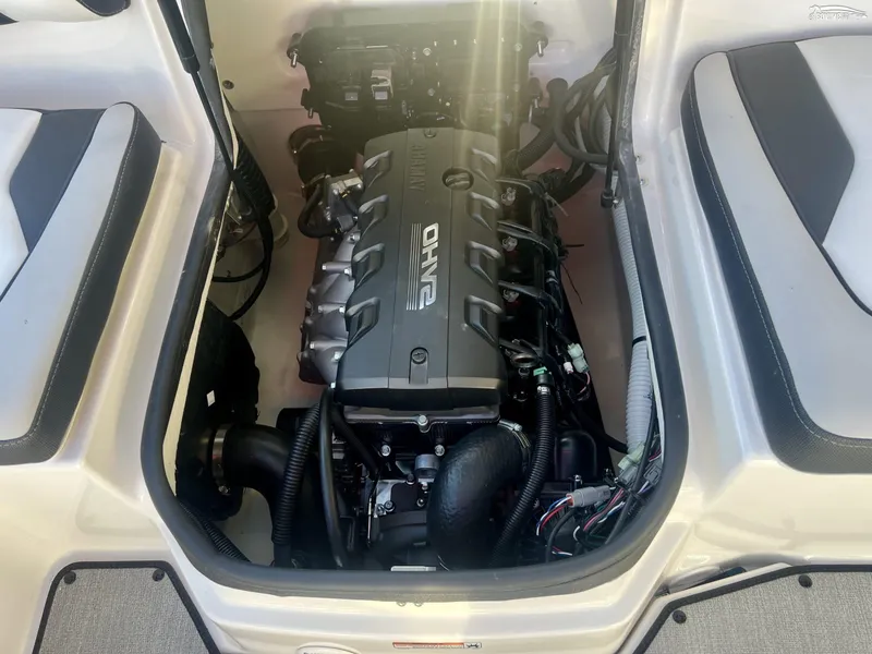Slide: The Image of 2025 Yamaha AR195 boat engine compartment with visible components and wiring. - 7