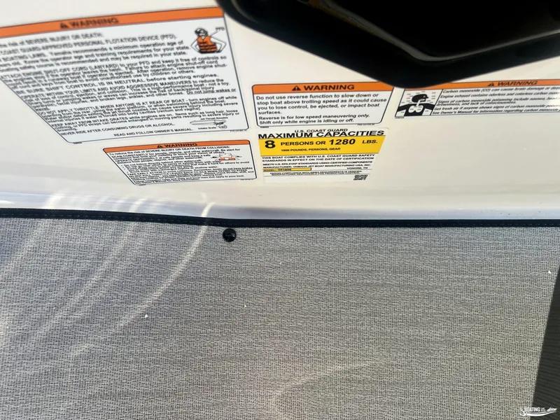 Slide: The Image of Warning labels on 2025 Yamaha Boats AR195, showing maximum capacity and safety instructions. - 9