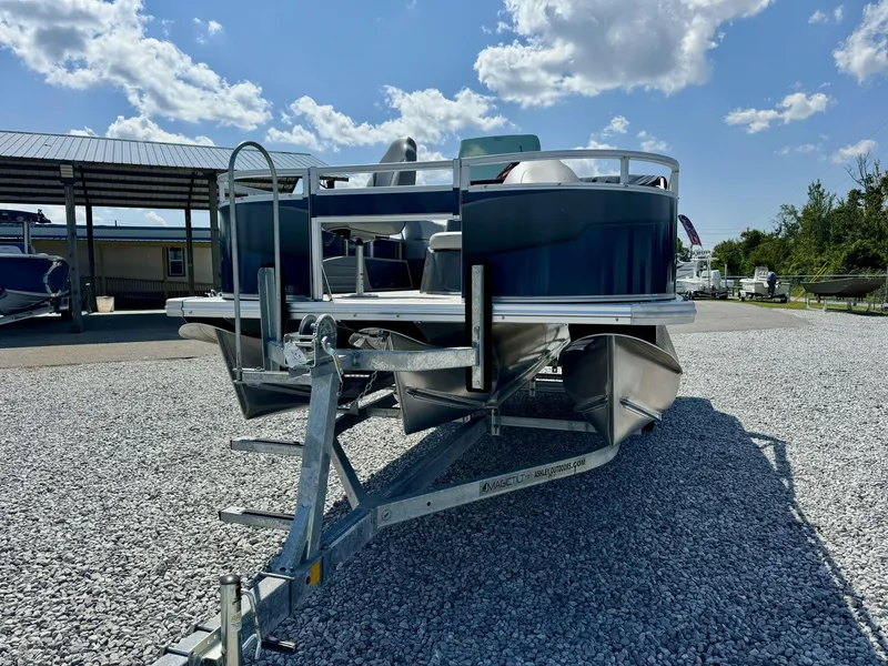 Slide: The Image of 2025 Tahoe Pontoon Sport 85, 23 FT center console fish boat on trailer. - 3