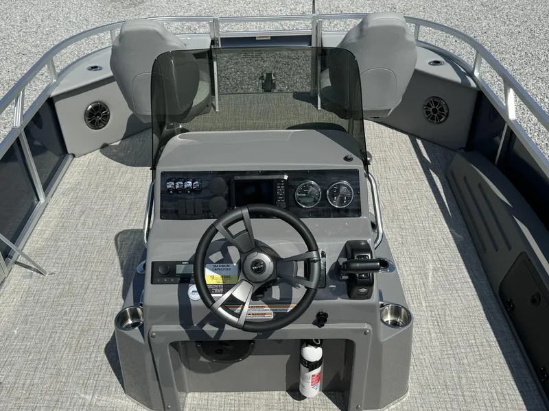 Slide: The Image of 2025 Tahoe Pontoon Sport 85 center console, steering wheel, and controls. - 5
