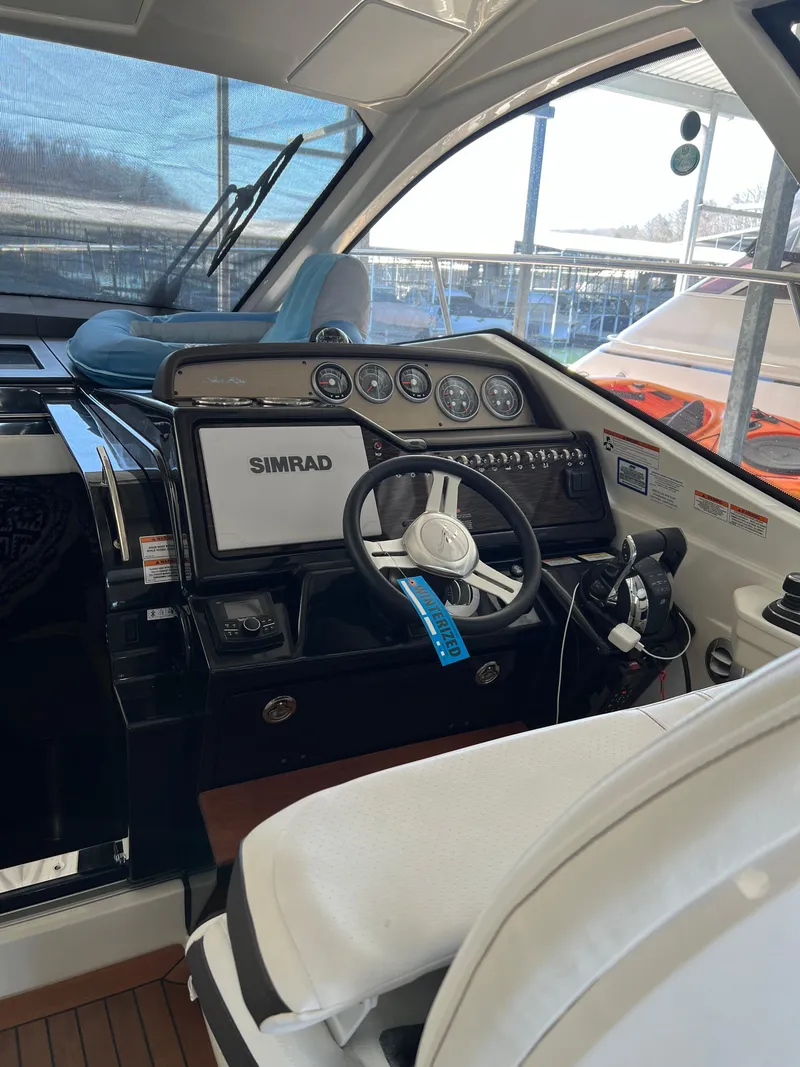 Slide: The Image of 2018 Sea Ray Sundancer 350 Coupe helm with Simrad navigation system. - 10