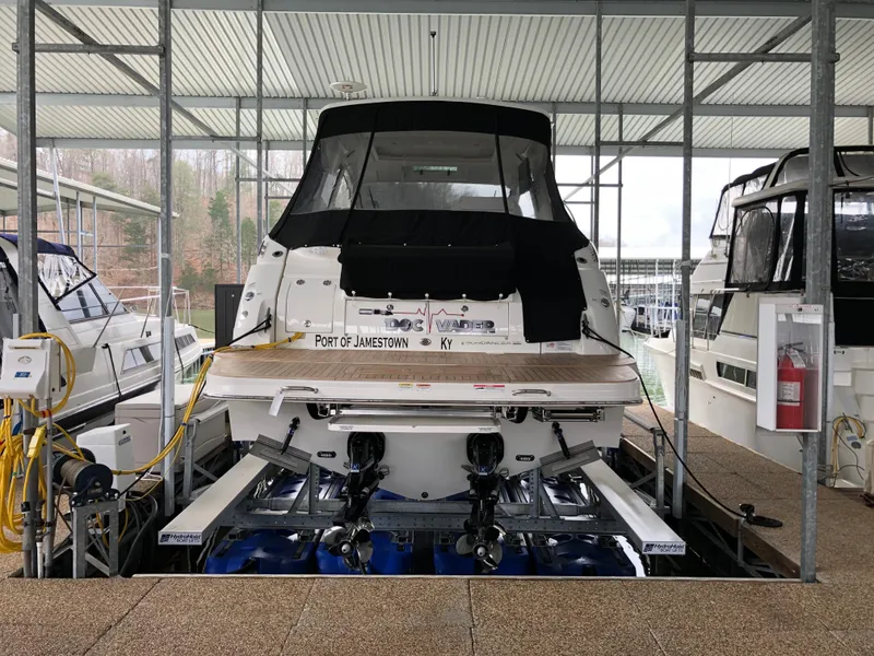 Slide: The Image of 2018 Sea Ray Sundancer 350 Coupe docked at marina, rear view. - 16