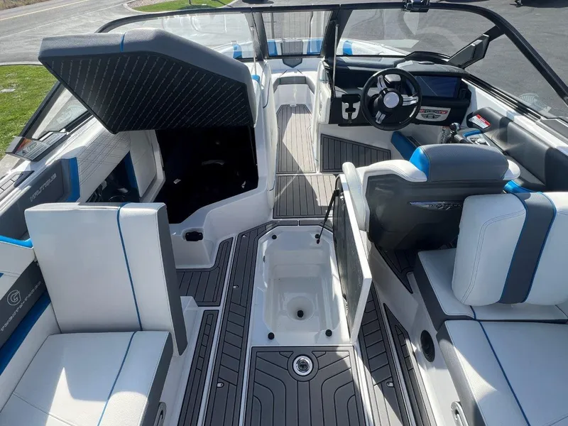 Slide: The Image of 2020 Nautique G23 boat interior with modern seating and steering wheel. - 15