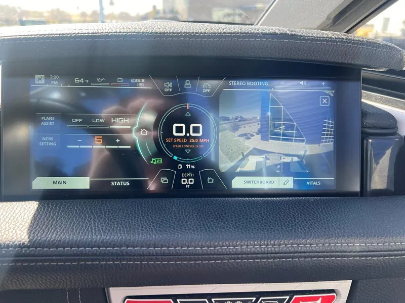 Slide: The Image of 2020 Nautique G23 dashboard display showing speed, settings, and camera view. - 17