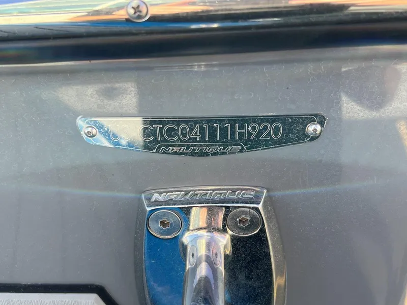 Slide: The Image of 2020 Nautique G23 boat identification plate with serial number and logo. - 24
