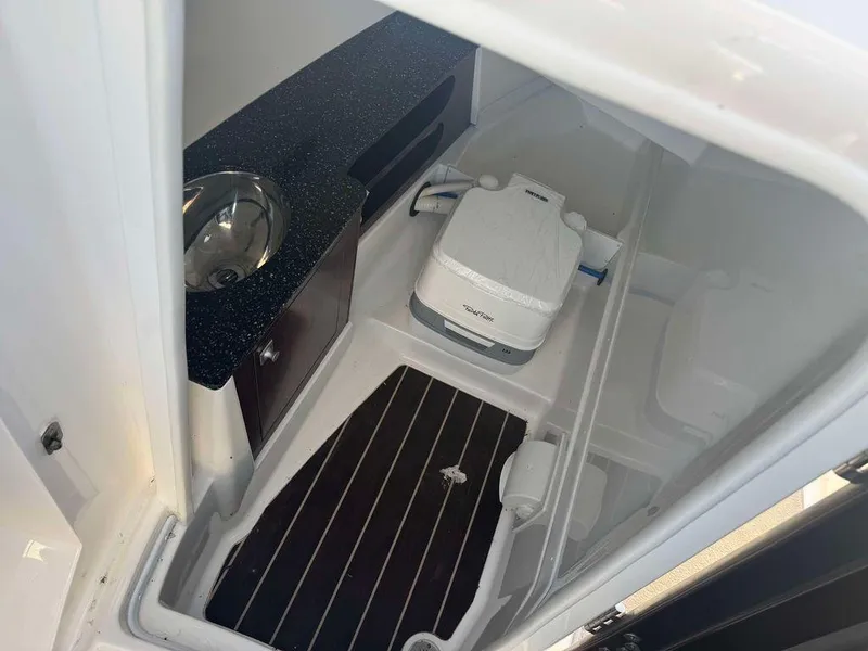 Slide: The Image of 2015 Monterey 288SS boat interior with sink and portable toilet. - 6