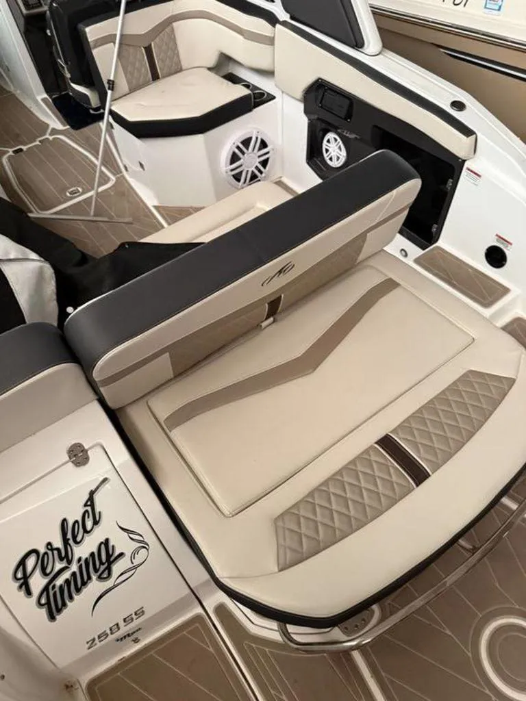 Slide: The Image of 2016 Sea Ray SLX 250 boat interior with beige seating and "Perfect Timing" text. - 4