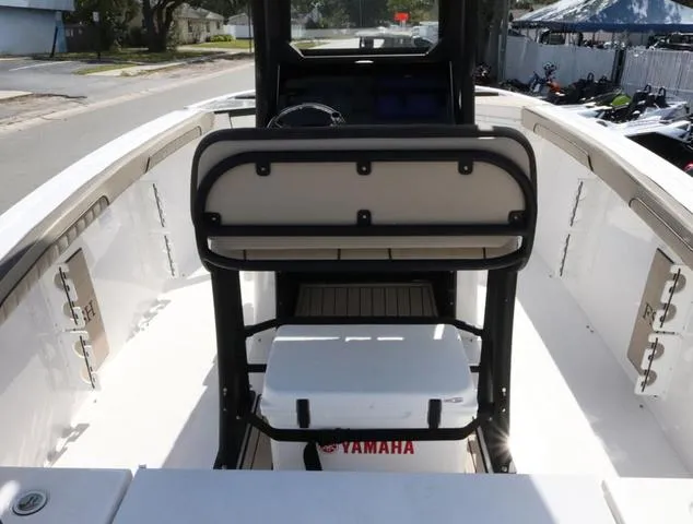 Slide: The Image of 2025 Yamaha Boats 255 FSH SPORT H-SEAFOAM G interior with tan seating and deck. - 10