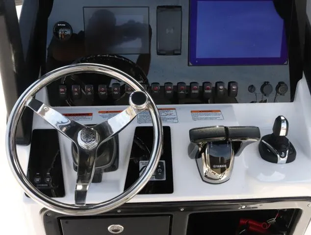 Slide: The Image of 2025 Yamaha Boats 255 FSH SPORT H-SEAFOAM G, luxury seating and sleek design. - 15