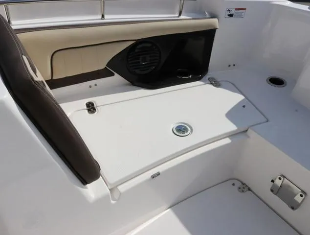 Slide: The Image of 2025 Yamaha Boats 255 FSH SPORT H-SEAFOAM G interior seating and storage area. - 21