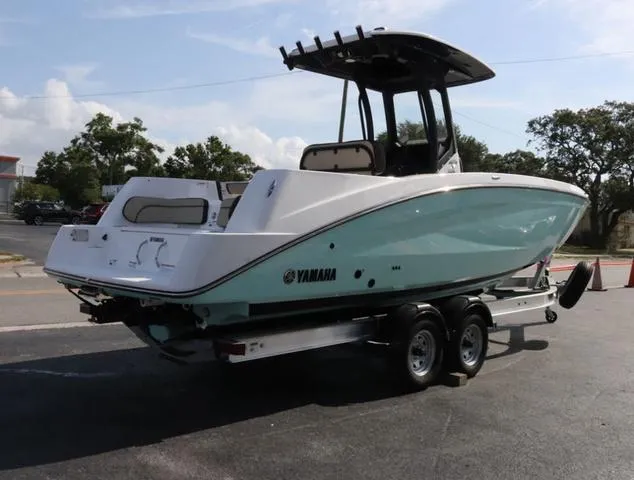 Slide: The Image of 2025 Yamaha Boats 255 FSH SPORT H-SEAFOAM G helm with modern controls and steering wheel. - 4