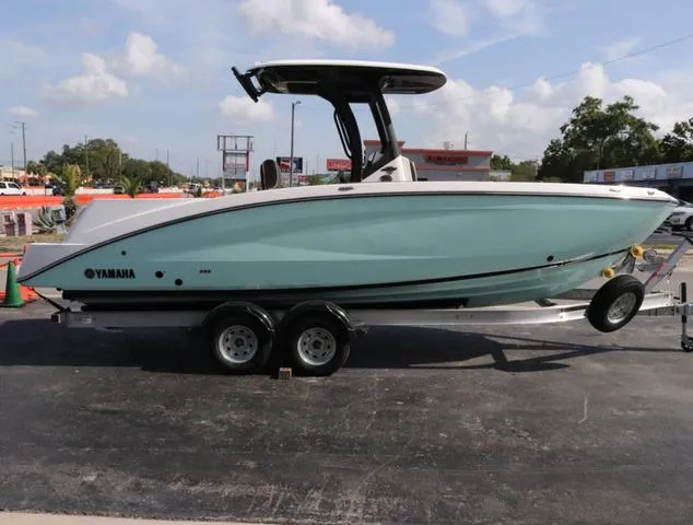 Slide: The Image of 2025 Yamaha Boats 255 FSH SPORT H-SEAFOAM G dashboard with steering wheel and controls. - 5