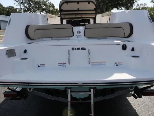 Slide: The Image of 2025 Yamaha Boats 255 FSH SPORT H-SEAFOAM G interior with seating and deck features. - 9