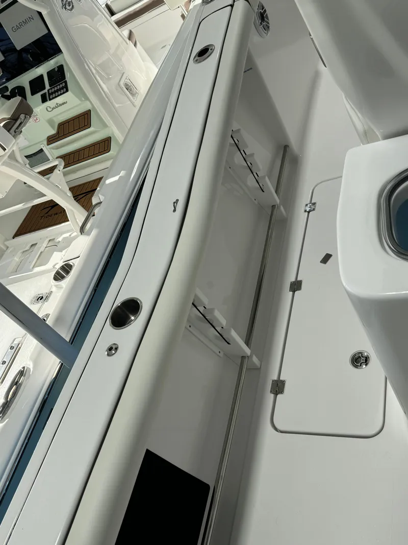 Slide: The Image of 2024 Tidewater 272 CC Adventure boat interior with sleek design and modern features. - 9