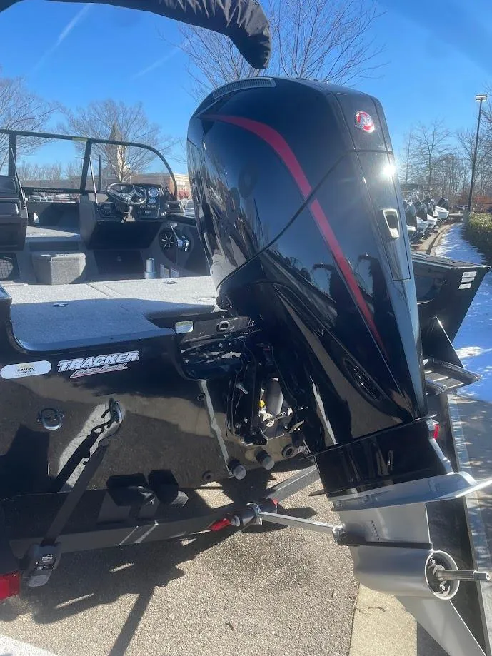 Slide: The Image of 2025 Tracker Targa V-19 Combo boat with a sleek black outboard motor. - 3