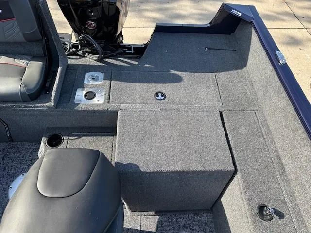 Slide: The Image of 2025 Tracker Pro Guide V-175 Combo boat interior with seating and storage compartments. - 10