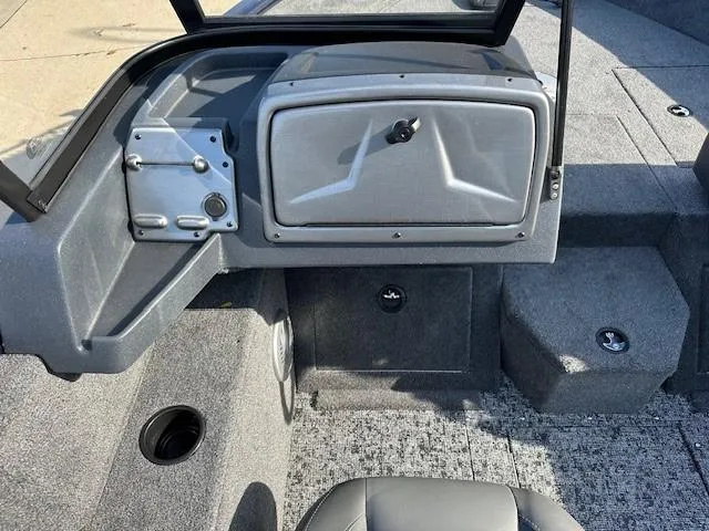 Slide: The Image of 2025 Tracker Pro Guide V-175 Combo boat interior with storage compartments and seating. - 6